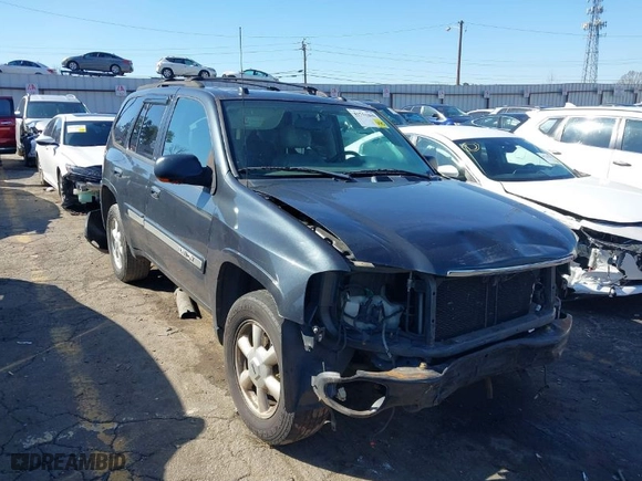 2005 GMC Envoy SLE with VIN 1GKDS13S252305661, listed as a IAAI auction lot 41751800 with 235,090 mi miles. Bid and sale history available at carsss.com. Image 1.