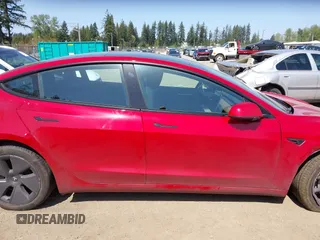 2023 Tesla Model 3 Long Range with VIN 5YJ3E1EBXPF603421, listed as a IAAI auction lot 42105037 with 13,186 mi miles and . Bid and sale history available at DreamBid. Image 13.