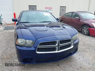 2013 Dodge Charger SE z VIN 2C3CDXBG7DH580034, wystawiony jako IAAI lot #42209139 z przebiegiem 185 906 mil mil oraz . Historia ofert i sprzedaży dostępna na DreamBid. Obrazek 6.