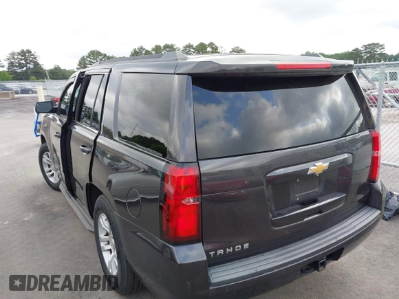 2015 Chevrolet Tahoe LS with VIN 1GNSCAKC0FR245826, listed as a IAAI auction lot 42282590 with 164,208 mi miles and . Bid and sale history available at DreamBid. Image 3.