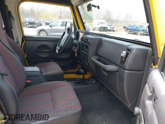 2000 Jeep Wrangler Sport with VIN 1J4FA49S2YP768451, listed as a IAAI auction lot 42136785 with 74,492 mi miles. Bid and sale history available at carsss.com. Image 5.