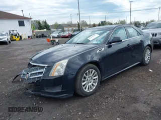 2011 Cadillac CTS z VIN 1G6DC5EY9B0153096, wystawiony jako IAAI lot #42146595 z przebiegiem 148 990 mil mil oraz . Historia ofert i sprzedaży dostępna na DreamBid. Obrazek 2.