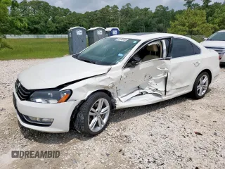 2014 Volkswagen Passat SEL Premium with VIN 1VWCN7A37EC063311, listed as a Copart auction lot 59150005 with 130,888 mi miles and Salvage title. Bid and sale history available at DreamBid. Image 1.