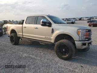 2017 Ford F-250 Lariat with VIN 1FT7W2BT0HEE63562, listed as a Copart auction lot 60880545 with 122,996 mi miles and Salvage title. Bid and sale history available at DreamBid. Image 4.