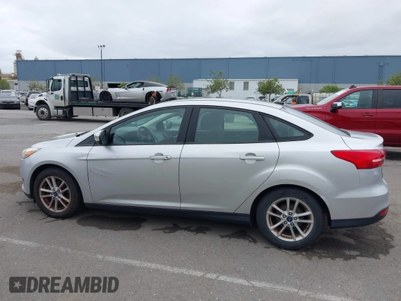 2015 Ford Focus SE z VIN 1FADP3F21FL218369, wystawiony jako IAAI lot #42126986 z przebiegiem 99 844 mil mil oraz . Historia ofert i sprzedaży dostępna na DreamBid. Obrazek 14.