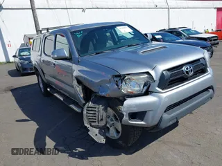 2014 Toyota Tacoma with VIN 3TMLU4EN7EM146705, listed as a IAAI auction lot 41949827 with 147,887 mi miles and . Bid and sale history available at DreamBid. Image 1.