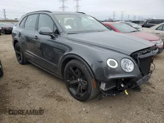 2019 Bentley Bentayga V8 z VIN SJAAM2ZV3KC027120, wystawiony jako Copart lot #83595274 z przebiegiem 28 972 mil mil oraz Szkoda całkowita • Salvage title. Historia ofert i sprzedaży dostępna na DreamBid. Obrazek 4.