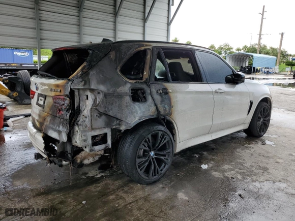 2015 BMW X5 M with VIN 5YMKT6C55F0C89468, listed as a Copart auction lot 75391074 with 0 mi miles and Salvage Title. Bid and sale history available at carsss.com. Image 3.