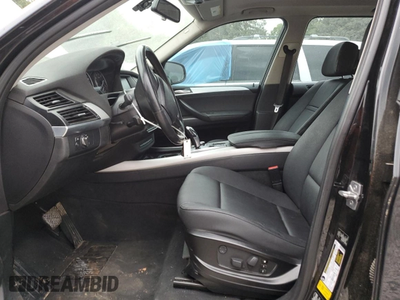 2012 BMW X5 35i with VIN 5UXZV4C59CL763577, listed as a Copart auction lot 62496155 with 148,240 mi miles and Clean title. Bid and sale history available at DreamBid. Image 7.