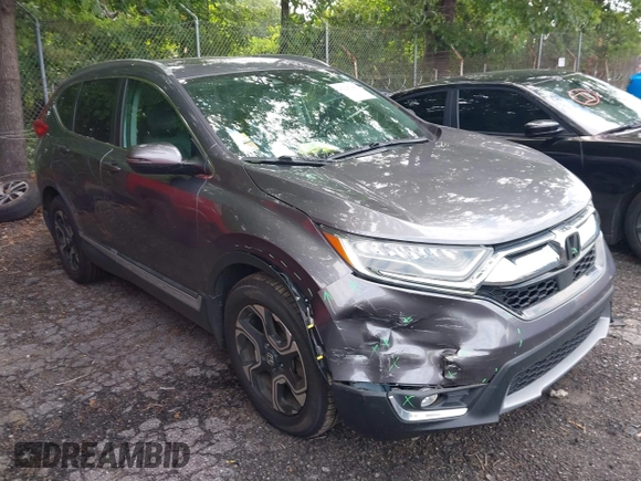 2018 Honda CR-V Touring z VIN 7FARW1H9XJE040530, wystawiony jako IAAI lot #42227446 z przebiegiem 101 299 mil mil oraz . Historia ofert i sprzedaży dostępna na DreamBid. Obrazek 1.