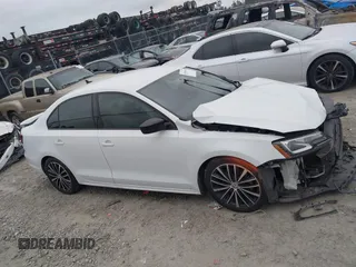 2016 Volkswagen Jetta Sport z VIN 3VWD17AJ0GM394943, wystawiony jako IAAI lot #41844346 z przebiegiem Nie podano mil oraz . Historia ofert i sprzedaży dostępna na DreamBid. Obrazek 14.