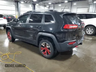 2015 Jeep Cherokee Trailhawk with VIN 1C4PJMBS5FW587545, listed as a Copart auction lot 58820685 with 136,755 mi miles and Salvage title. Bid and sale history available at DreamBid. Image 2.