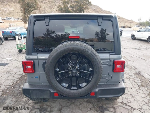 2021 Jeep Wrangler 4xe Unlimited Sahara with VIN 1C4JJXP64MW720263, listed as a IAAI auction lot 41514302 with 73,300 mi miles. Bid and sale history available at carsss.com. Image 17.