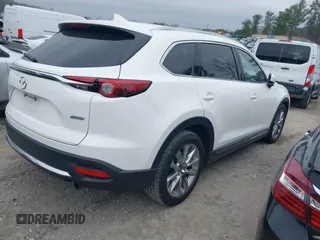 2016 Mazda CX-9 Grand Touring with VIN JM3TCADY0G0113779, listed as a IAAI auction lot 41466750 with 58,035 mi miles and . Bid and sale history available at DreamBid. Image 4.