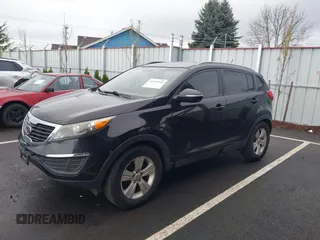 2011 Kia Sportage LX with VIN KNDPB3A26B7100916, listed as a IAAI auction lot 41939760 with 205,890 mi miles and . Bid and sale history available at carsss.com. Image 2.