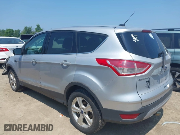 2014 Ford Escape SE with VIN 1FMCU9GX3EUC42964, listed as a IAAI auction lot 42484080 with 124,696 mi miles and . Bid and sale history available at DreamBid. Image 3.