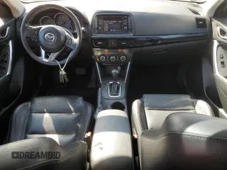 2014 Mazda CX-5 Grand Touring with VIN JM3KE4DY8E0421660, listed as a Copart auction lot 48588525 with 144,939 mi miles and Salvage Title. Bid and sale history available at DreamBid. Image 8.