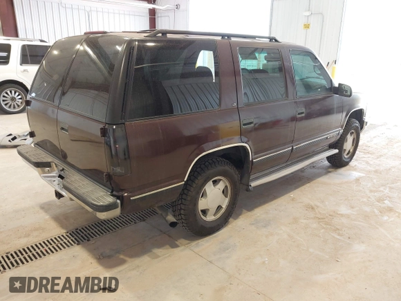 1996 Chevrolet Tahoe z VIN 1GNEK13R3TJ387858, wystawiony jako IAAI lot #41675147 z przebiegiem 196 811 mil mil oraz . Historia ofert i sprzedaży dostępna na DreamBid. Obrazek 4.