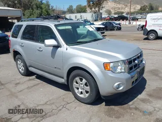 2009 Ford Escape Hybrid with VIN 1FMCU49309KC11542, listed as a IAAI auction lot 42028593 with 168,573 mi miles. Bid and sale history available at carsss.com. Image 1.
