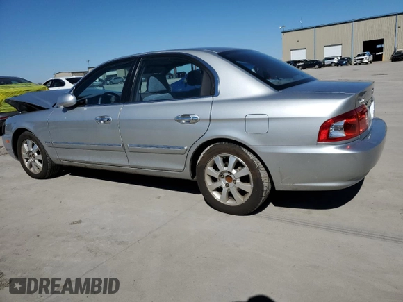 2005 Kia Optima LX z VIN KNAGD128055433689, wystawiony jako Copart lot #46909305 z przebiegiem 27 609 mil mil oraz Szkoda całkowita • Salvage title. Historia ofert i sprzedaży dostępna na DreamBid. Obrazek 2.