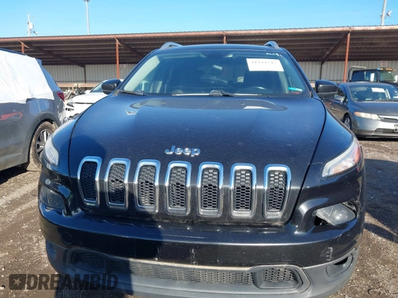 2014 Jeep Cherokee Latitude z VIN 1C4PJMCS2EW124467, wystawiony jako IAAI lot #41944747 z przebiegiem 132 890 mil mil oraz . Historia ofert i sprzedaży dostępna na DreamBid. Obrazek 6.