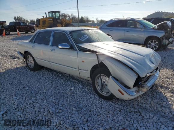 1995 Jaguar XJ with VIN SAJKX1745SC739290, listed as a Copart auction lot 82887524 with Not provided miles and Salvage title. Bid and sale history available at DreamBid. Image 4.