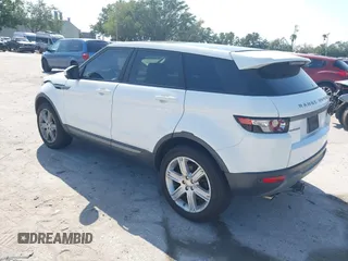 2015 Land Rover Range Rover Evoque Pure Premium z VIN SALVR2BG0FH964683, wystawiony jako IAAI lot #42016766 z przebiegiem 94 942 mil mil oraz . Historia ofert i sprzedaży dostępna na DreamBid. Obrazek 3.