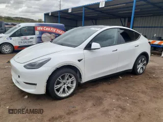 2023 Tesla Model Y Long Range z VIN 7SAYGDEEXPF800118, wystawiony jako Copart lot #52768295 z przebiegiem 28 634 mil mil oraz Szkoda całkowita • Salvage title. Historia ofert i sprzedaży dostępna na DreamBid. Obrazek 1.