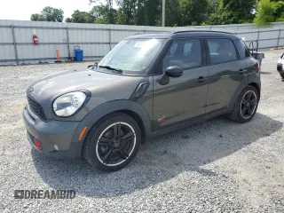 2012 MINI Countryman S with VIN WMWZC5C5XCWL56232, listed as a Copart auction lot 60298705 with 140,425 mi miles and Salvage title. Bid and sale history available at DreamBid. Image 1.