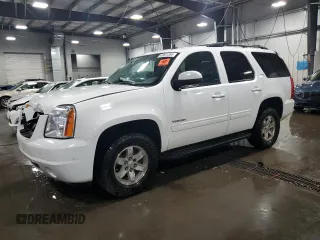 2014 GMC Yukon SLT with VIN 1GKS2CE01ER123696, listed as a Copart auction lot 63401554 with 177,174 mi miles and Salvage Title. Bid and sale history available at carsss.com. Image 1.