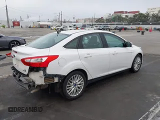 2012 Ford Focus SEL with VIN 1FAHP3H27CL314291, listed as a IAAI auction lot 41859207 with 86,830 mi miles. Bid and sale history available at carsss.com. Image 4.