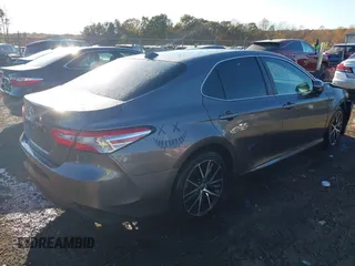 2020 Toyota Camry LE with VIN 4T1C11AKXLU884764, listed as a IAAI auction lot 40821088 with 111,631 mi miles. Bid and sale history available at carsss.com. Image 4.