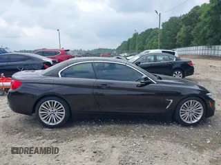 2014 BMW 4 Series 435i with VIN WBA3T3C50EJ876997, listed as a IAAI auction lot 42406299 with 115,048 mi miles and . Bid and sale history available at DreamBid. Image 13.