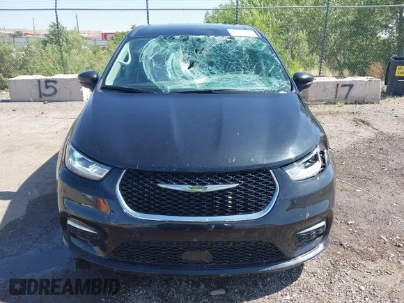 2023 Chrysler Pacifica Touring L with VIN 2C4RC1BG9PR628170, listed as a IAAI auction lot 42515590 with 41,987 mi miles and . Bid and sale history available at DreamBid. Image 12.