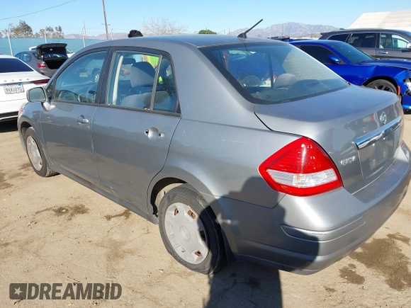 2009 Nissan Versa 1.8 S with VIN 3N1BC11E29L398542, listed as a IAAI auction lot 41689382 with 96,964 mi miles. Bid and sale history available at carsss.com. Image 3.