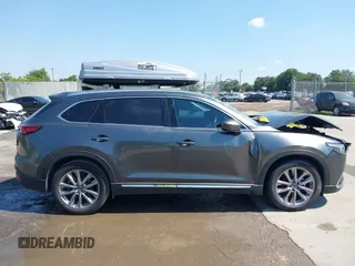 2022 Mazda CX-9 Grand Touring with VIN JM3TCBDY4N0618680, listed as a IAAI auction lot 40086806 with 34,142 mi miles and . Bid and sale history available at DreamBid. Image 13.