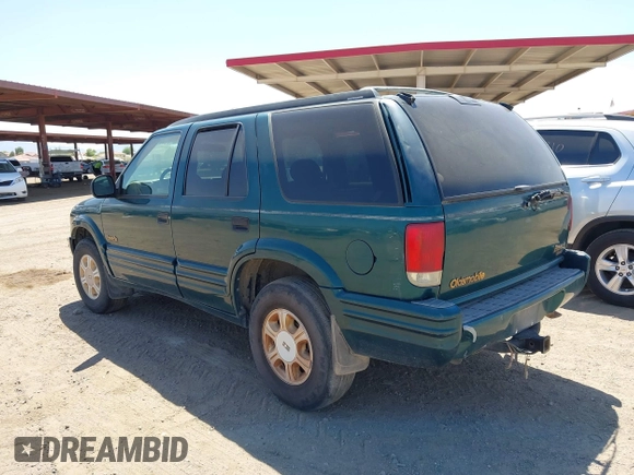 1996 Oldsmobile Bravada z VIN 1GHDT13W5T2711291, wystawiony jako IAAI lot #42502672 z przebiegiem 219 062 mil mil oraz . Historia ofert i sprzedaży dostępna na DreamBid. Obrazek 3.