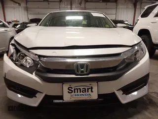 2018 Honda Civic EX with VIN 19XFC2F74JE005647, listed as a IAAI auction lot 41938607 with 90,263 mi miles and . Bid and sale history available at DreamBid. Image 13.