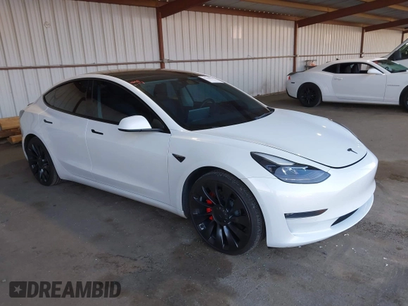 2021 Tesla Model 3 Performance with VIN 5YJ3E1EC4MF097993, listed as a IAAI auction lot 41366615 with 30,735 mi miles and . Bid and sale history available at DreamBid. Image 1.