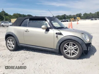 2011 MINI Convertible with VIN WMWZN3C54BT133246, listed as a Copart auction lot 69780074 with 176,955 mi miles and Salvage title. Bid and sale history available at DreamBid. Image 4.