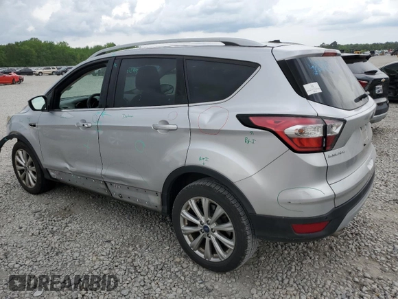 2017 Ford Escape Titanium with VIN 1FMCU0J96HUC12822, listed as a Copart auction lot 54259375 with 127,114 mi miles and Salvage Title. Bid and sale history available at DreamBid. Image 2.