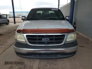 2001 Ford F-150 XLT с VIN 1FTRW07L01KA04562, выставлен на аукционе Copart как лот 52741935 с пробегом 288 598 миль миль и Списание • Salvage title. История ставок и продаж доступна на DreamBid. Изображение 5.