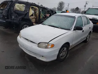 1999 Hyundai Accent z VIN KMHVF24N1XU583604, wystawiony jako IAAI lot #41613240 z przebiegiem 163 938 mil mil oraz . Historia ofert i sprzedaży dostępna na DreamBid. Obrazek 2.