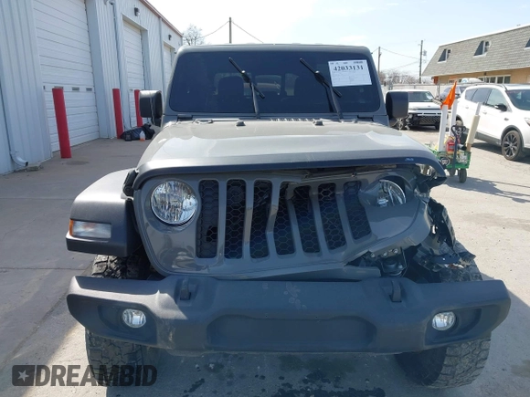 2020 Jeep Gladiator Sport S z VIN 1C6HJTAG7LL154664, wystawiony jako IAAI lot #42033131 z przebiegiem 73 282 mil mil oraz . Historia ofert i sprzedaży dostępna na DreamBid. Obrazek 13.