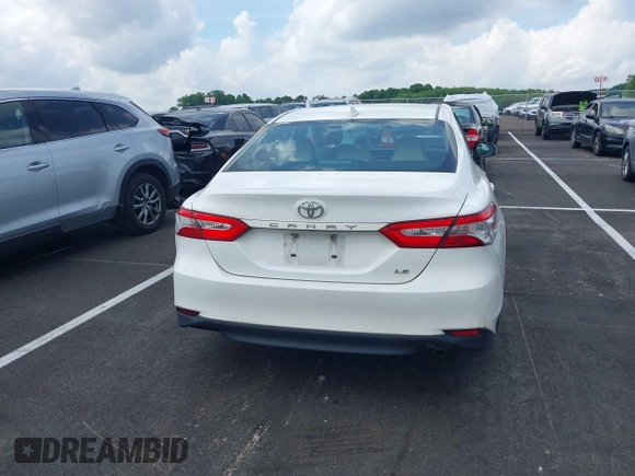 2019 Toyota Camry LE with VIN 4T1B11HK2KU743445, listed as a IAAI auction lot 42129688 with 284,938 mi miles and . Bid and sale history available at DreamBid. Image 16.