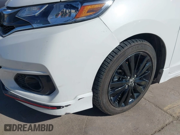 2018 Honda Fit Sport z VIN 3HGGK5H62JM732645, wystawiony jako IAAI lot #41216302 z przebiegiem 107 128 mil mil oraz . Historia ofert i sprzedaży dostępna na DreamBid. Obrazek 19.