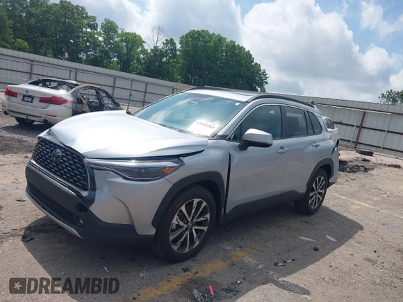 2023 Toyota Corolla Cross XLE with VIN 7MUDAAAG0PV057750, listed as a IAAI auction lot 42302284 with 31,404 mi miles and . Bid and sale history available at DreamBid. Image 17.