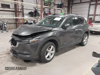 2020 Mazda CX-5 Grand Touring with VIN JM3KFBDM3L0739763, listed as a IAAI auction lot 41751250 with 88,063 mi miles and . Bid and sale history available at carsss.com. Image 2.