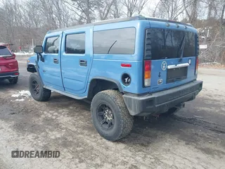 2003 Hummer H2 with VIN 5GRGN23U33H144964, listed as a IAAI auction lot 41621898 with Not Provided miles. Bid and sale history available at carsss.com. Image 3.