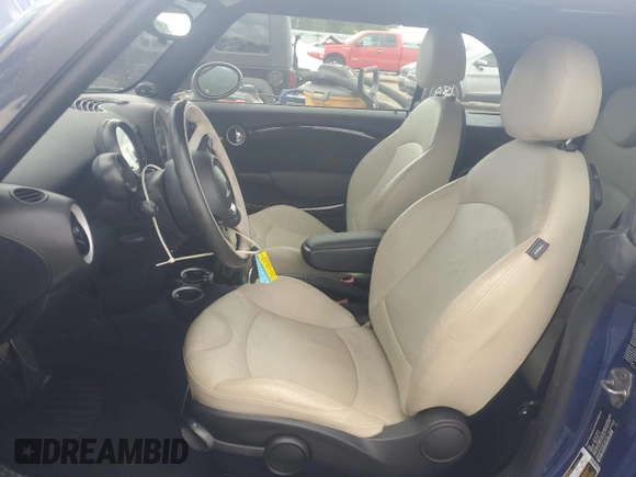 2015 MINI Convertible S with VIN WMWZP3C59F2A91231, listed as a Copart auction lot 59296415 with 31,642 mi miles and Salvage title. Bid and sale history available at DreamBid. Image 7.